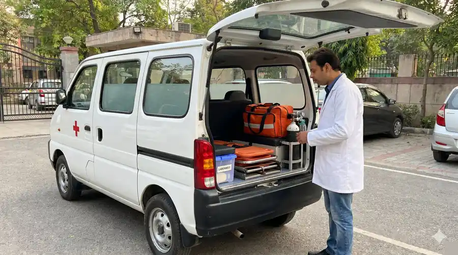 NoidaDoc Maruti Eeco medical vehicle with rear door open showing medical equipment
